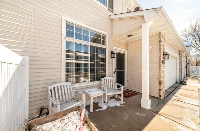 view of patio / terrace featuring a garage