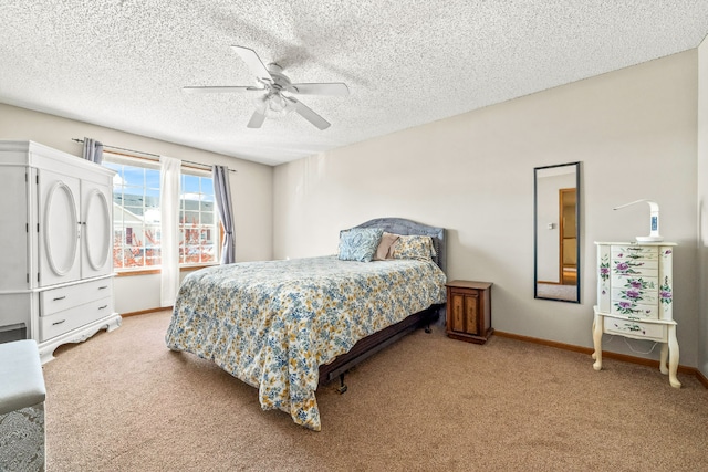 bedroom featuring ceiling fan, a textured ceiling, carpet, and baseboards