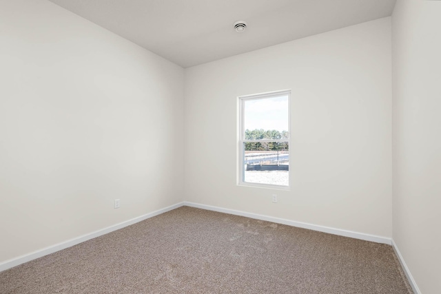 spare room featuring carpet floors