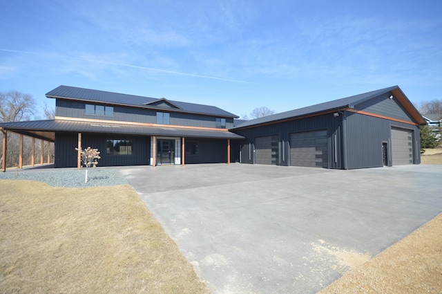view of front of property with an outbuilding and a garage