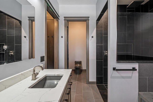 bathroom with tile patterned floors and vanity