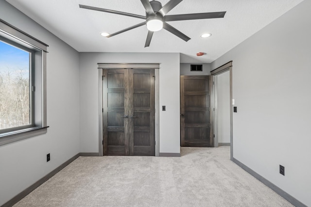 unfurnished bedroom with baseboards, recessed lighting, carpet, and a ceiling fan