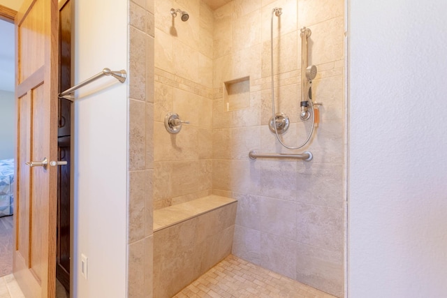 bathroom featuring tiled shower