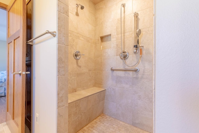 full bath featuring tiled shower