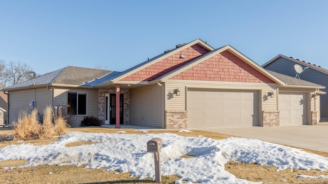 view of front facade featuring an attached garage, brick siding, and concrete driveway
