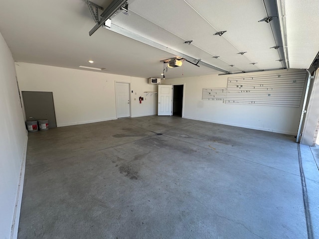 932 Oak Pond Ct, Sartell, MN 56377 - garage featuring baseboards and a garage door opener
