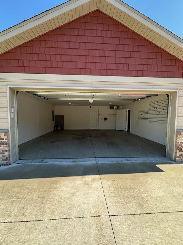 932 Oak Pond Ct, Sartell, MN 56377 - garage featuring concrete driveway