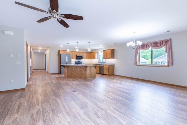 932 Oak Pond Ct, Sartell, MN 56377 - kitchen with stainless steel appliances, a chandelier, a center island, light countertops, and light wood-type flooring