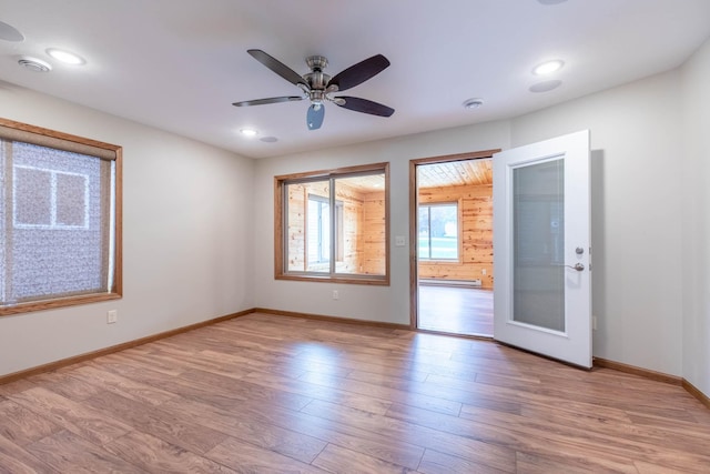 932 Oak Pond Ct, Sartell, MN 56377 - unfurnished room with light wood finished floors, a baseboard heating unit, baseboards, recessed lighting, and a ceiling fan