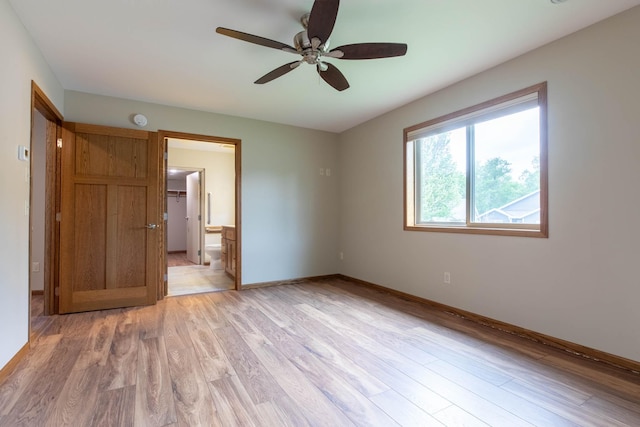 932 Oak Pond Ct, Sartell, MN 56377 - unfurnished room featuring light wood-style flooring, a ceiling fan, baseboards, and a smoke detector