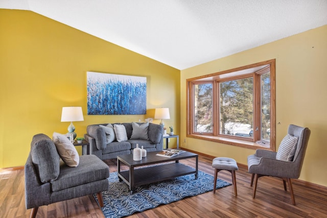 living room featuring vaulted ceiling and wood-type flooring