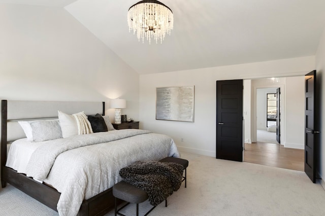 carpeted bedroom with vaulted ceiling and a chandelier