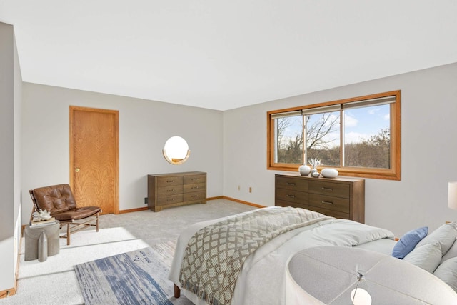 bedroom featuring light colored carpet