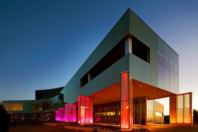 view of outdoor building at dusk