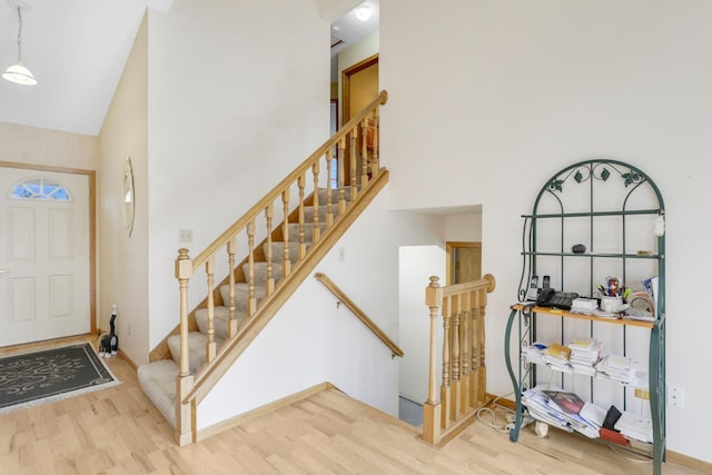 entrance foyer featuring a high ceiling and hardwood / wood-style floors