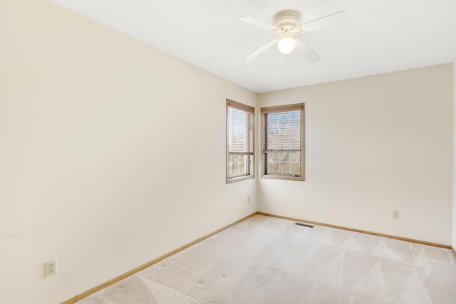 carpeted empty room with ceiling fan