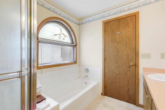 bathroom with vanity and a tub to relax in