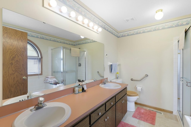 bathroom featuring vanity, crown molding, a shower with shower door, and toilet