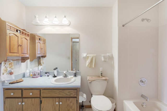 full bathroom with vanity, tiled shower / bath combo, and toilet