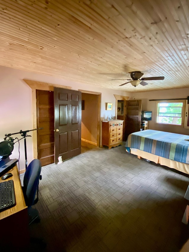 carpeted bedroom with wooden ceiling and ceiling fan