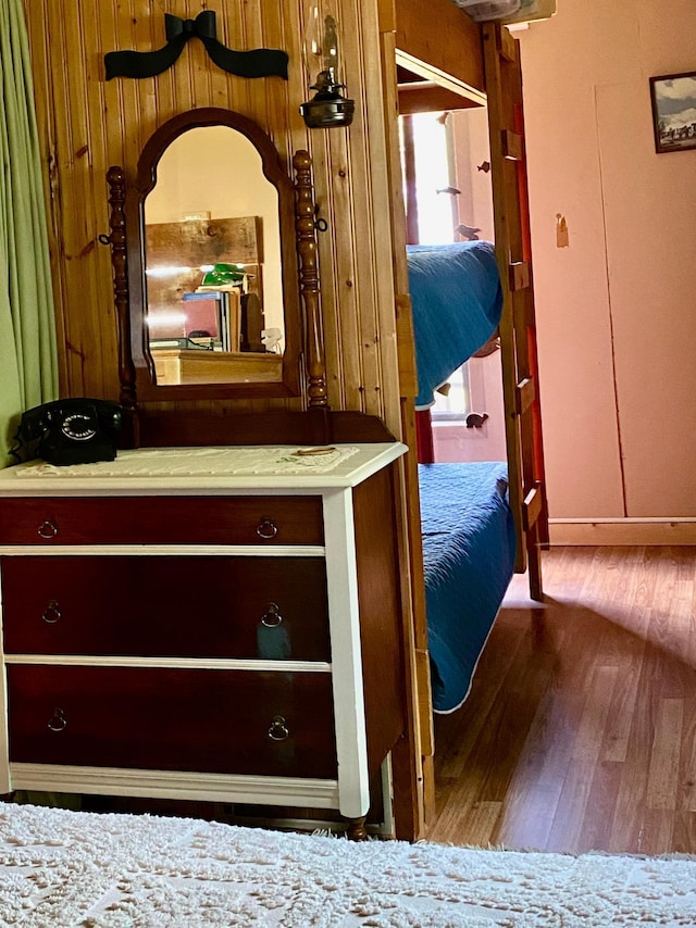 unfurnished bedroom with hardwood / wood-style floors