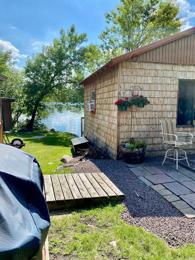 view of yard with a water view and cooling unit