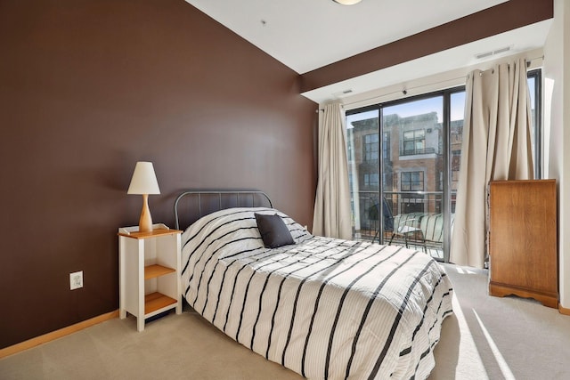 carpeted bedroom with vaulted ceiling