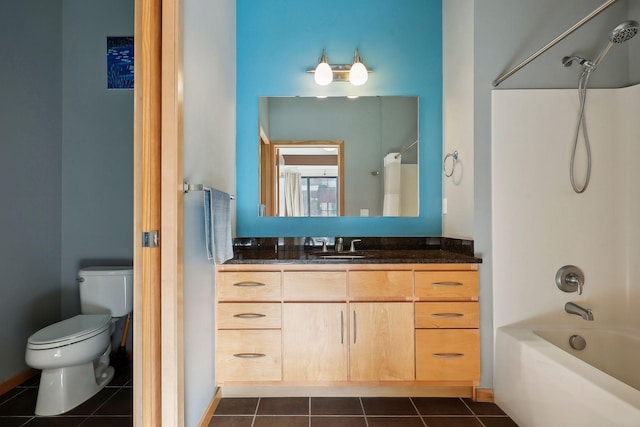 full bathroom featuring tile patterned flooring, vanity, shower / bathing tub combination, and toilet