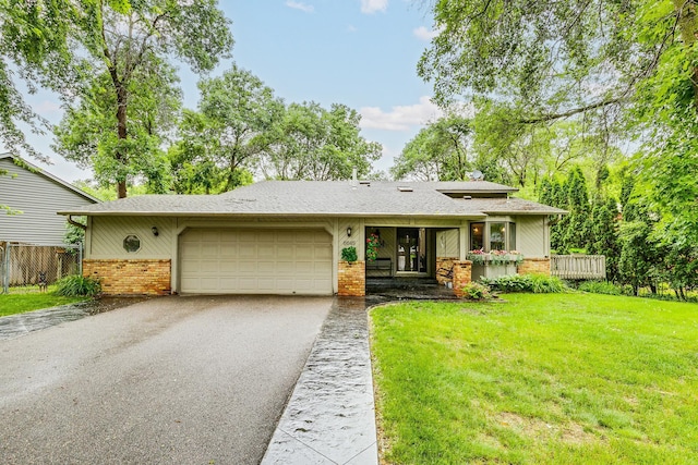 6645 Lancaster Ln N, Maple Grove, MN 55369 - view of front of home featuring brick siding, driveway, a garage, and a shingled roof