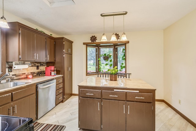 6645 Lancaster Ln N, Maple Grove, MN 55369 - kitchen with dishwasher, backsplash, light wood-style flooring, light countertops, and decorative light fixtures