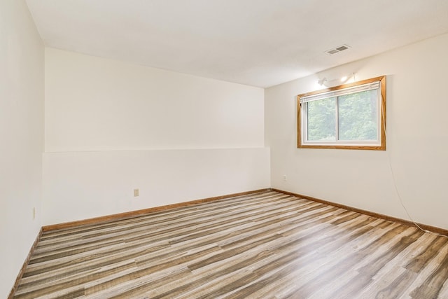 6645 Lancaster Ln N, Maple Grove, MN 55369 - unfurnished room with wood finished floors and baseboards