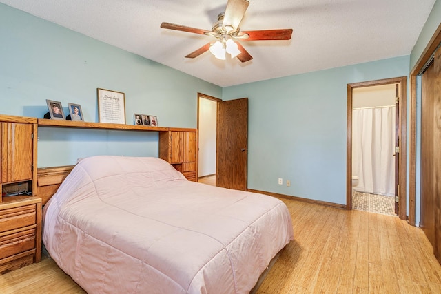 6645 Lancaster Ln N, Maple Grove, MN 55369 - bedroom featuring wood finished floors, ensuite bathroom, and ceiling fan