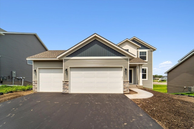 craftsman house with a garage