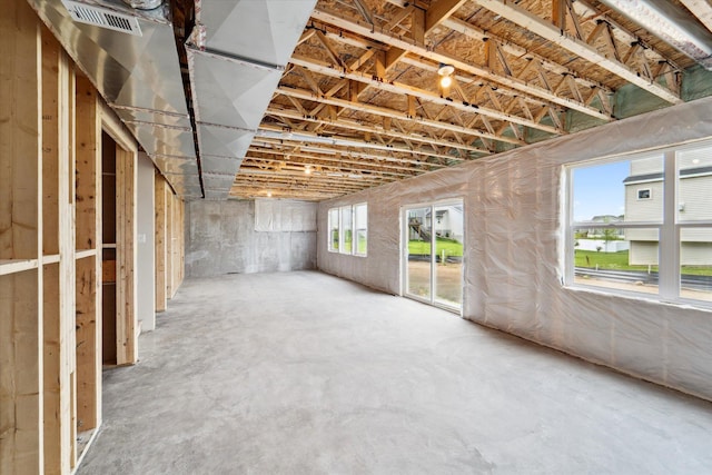 misc room with concrete flooring