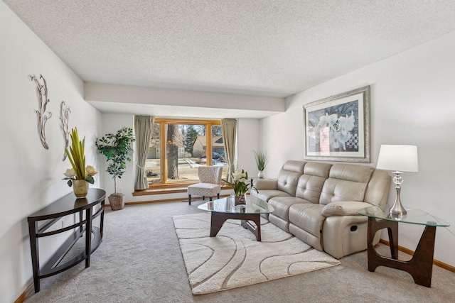 carpeted living room with a textured ceiling