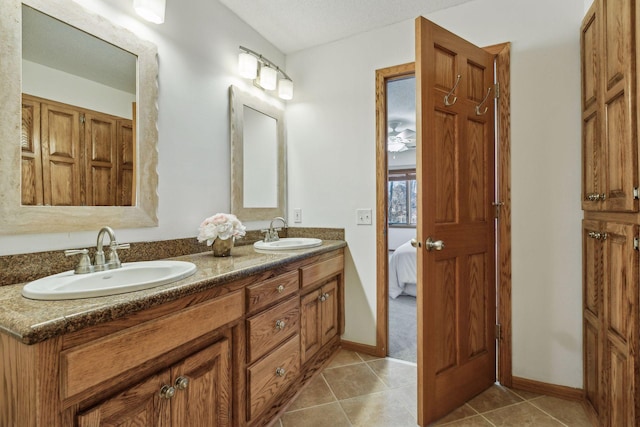 bathroom featuring tile patterned flooring and vanity