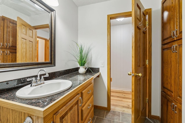 bathroom with tile patterned flooring and vanity