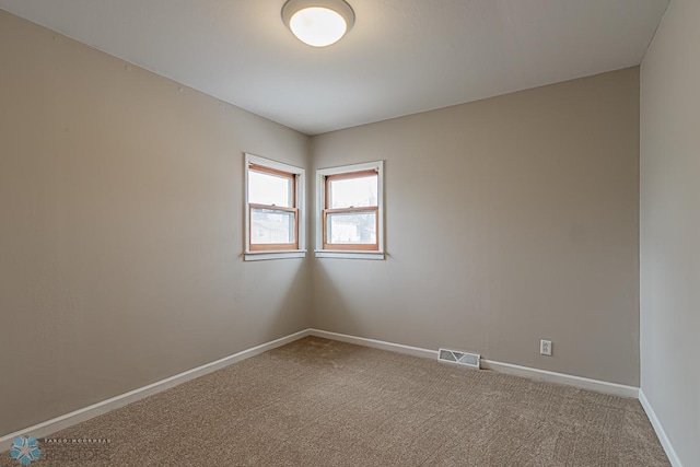 empty room featuring carpet flooring