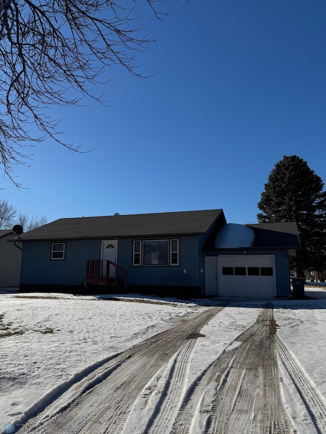 single story home featuring a garage