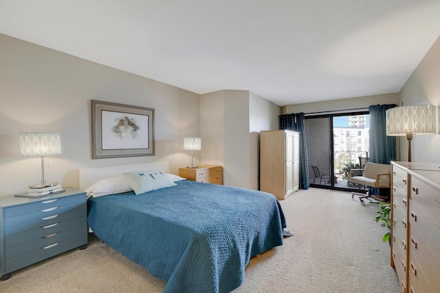 bedroom featuring light colored carpet