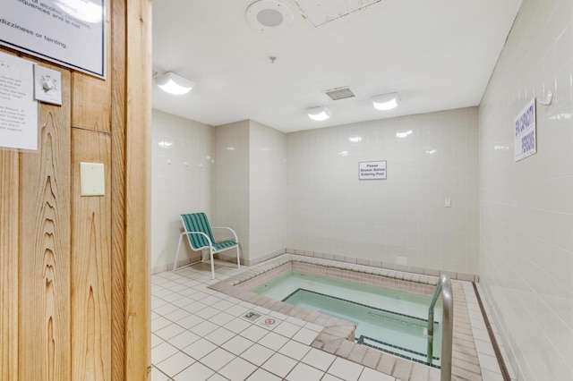 view of pool featuring an indoor hot tub