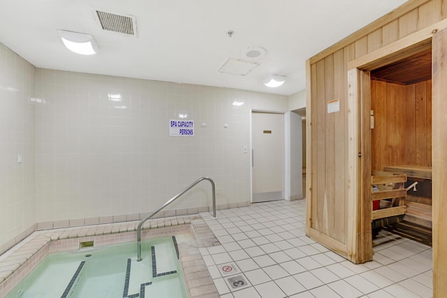 interior space featuring an indoor in ground hot tub