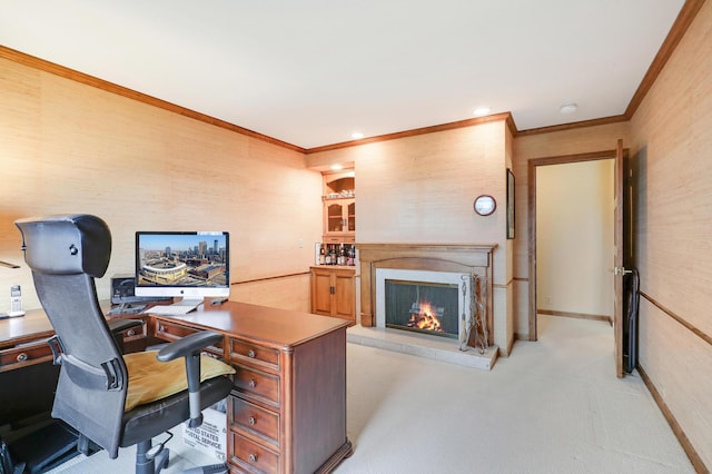 carpeted office space featuring ornamental molding and a high end fireplace