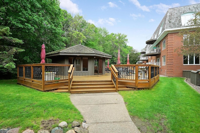 wooden deck featuring a yard