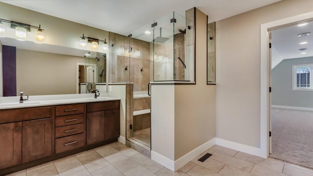 bathroom featuring tile patterned flooring, vanity, and an enclosed shower