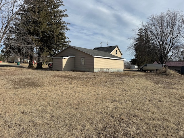 view of home's exterior with a yard