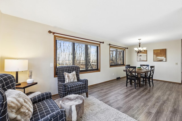 living room featuring hardwood / wood-style floors and a notable chandelier