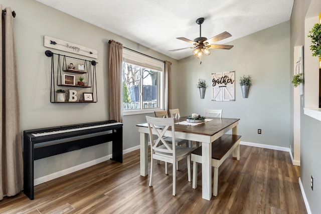 dining area featuring wood finished floors, baseboards, and ceiling fan