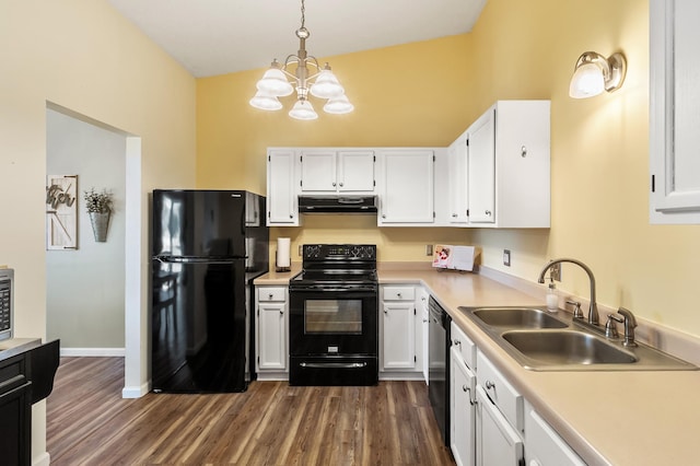 kitchen featuring black appliances, under cabinet range hood, a sink, white cabinets, and light countertops