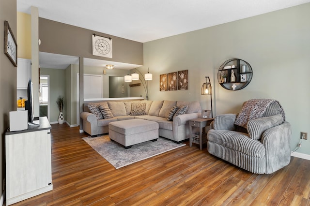 living room with wood finished floors and baseboards